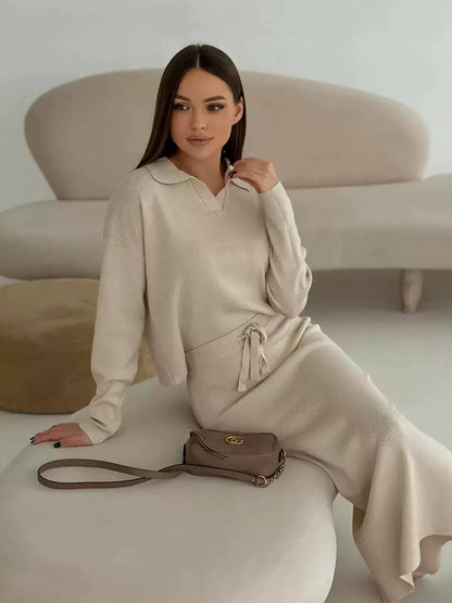 knitted two-piece matching set with collared long sleeve top and drawstring midi skirt.